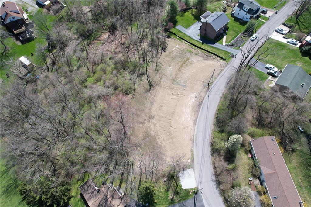 76 Midway Drive McKees Rocks, PA 15136 - Photo 9 of 28 an aerial view of a house with a yard and greenery