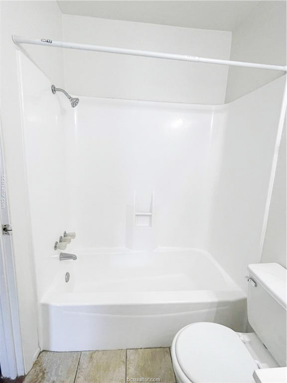 807 East 31st Street, Unit 1 Bryan, TX 77803 - Photo 8 of 8 a bathroom with a toilet and a bathtub
