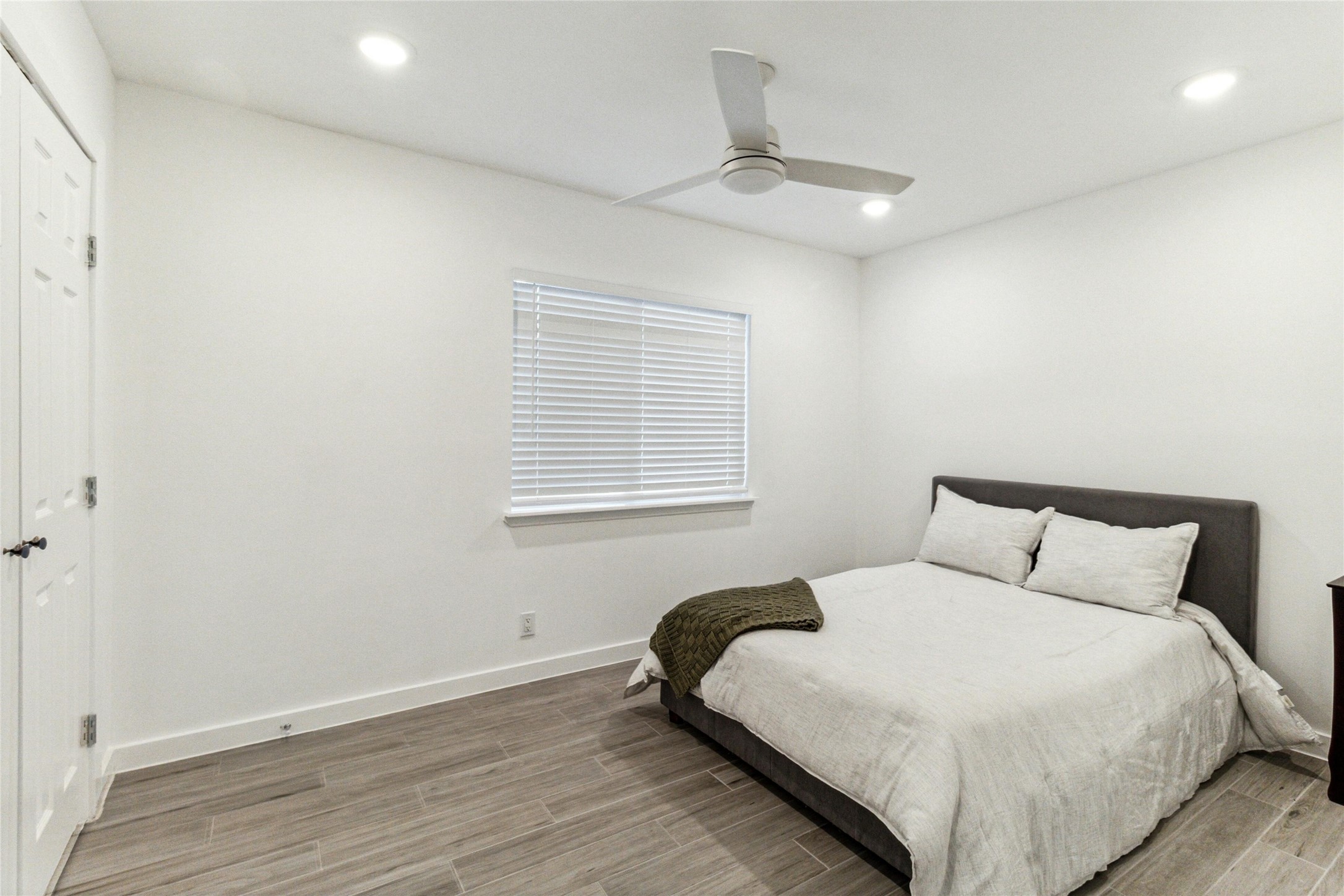 1200 East 52nd Street, Unit 101 Austin, TX 78723 - Photo 12 of 17 a bedroom with a bed and a window