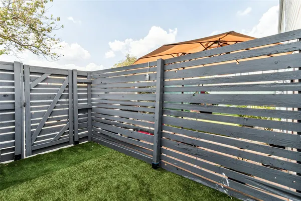 a view of a backyard with sitting area