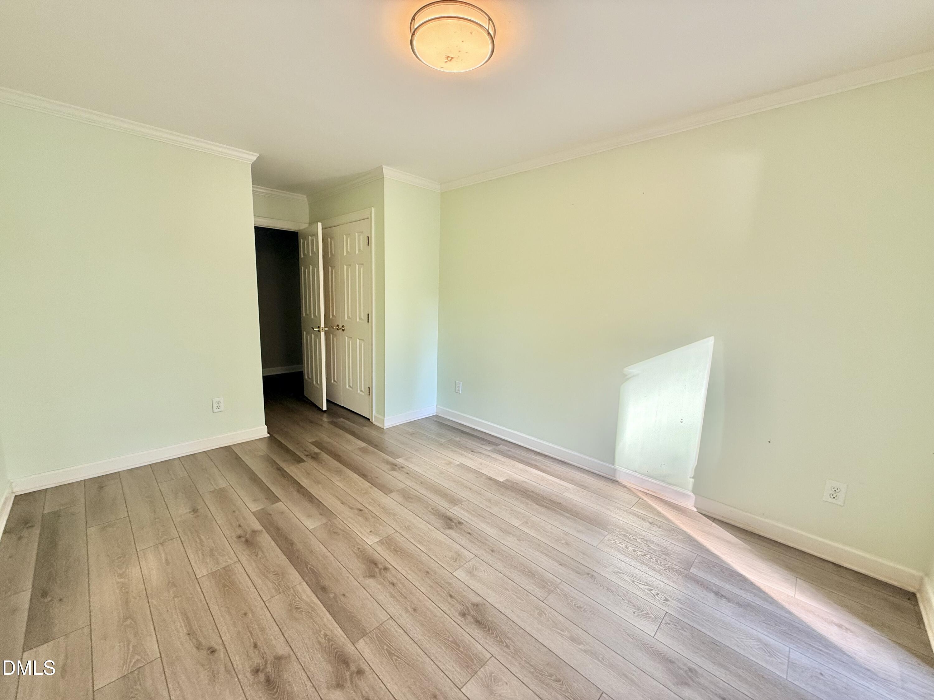 81 Beaver Crossing Road Roxboro, NC 27574 - Photo 35 of 80 an empty room with wooden floor and windows
