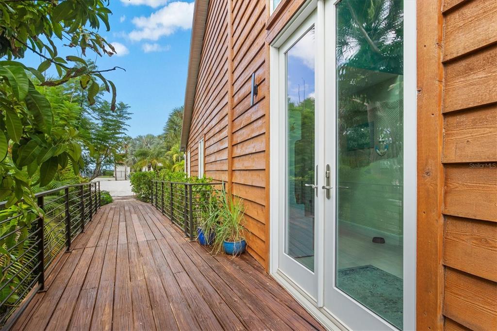 140 North Casey Key Road Osprey, FL 34229 - Photo 12 of 91 a view of balcony with wooden floor