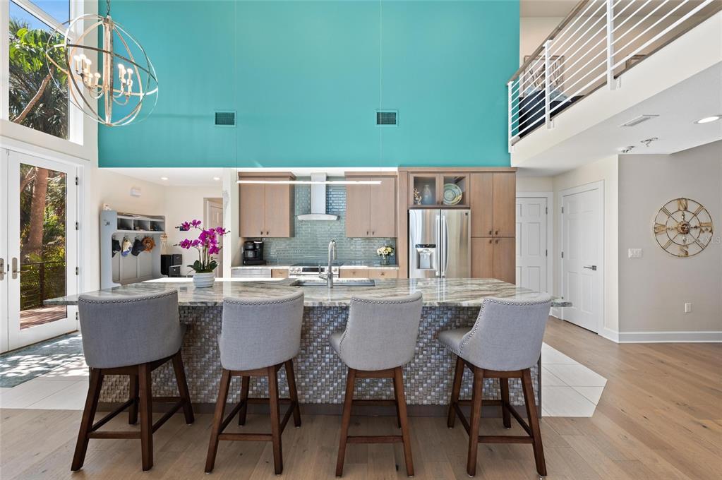 140 North Casey Key Road Osprey, FL 34229 - Photo 20 of 91 a kitchen with a table and chairs in it