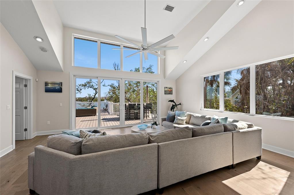 140 North Casey Key Road Osprey, FL 34229 - Photo 27 of 91 a living room with furniture and a large window