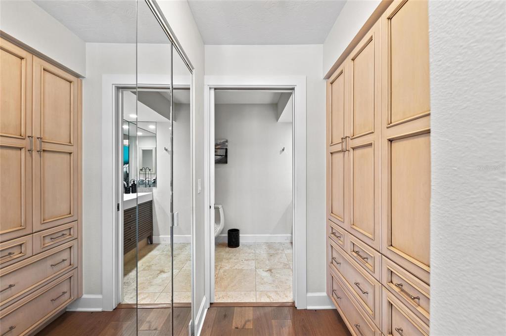 140 North Casey Key Road Osprey, FL 34229 - Photo 34 of 91 a view of a hallway with wooden floor and staircase