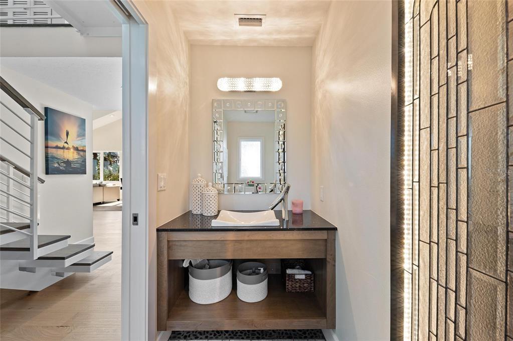 140 North Casey Key Road Osprey, FL 34229 - Photo 38 of 91 a room with a table and chairs in it