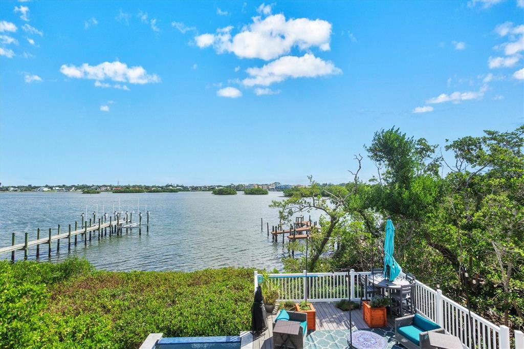140 North Casey Key Road Osprey, FL 34229 - Photo 4 of 91 a view of a lake from a balcony