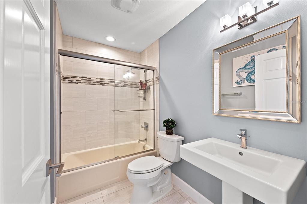 140 North Casey Key Road Osprey, FL 34229 - Photo 54 of 91 a bathroom with a sink toilet and shower