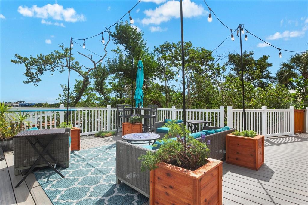 140 North Casey Key Road Osprey, FL 34229 - Photo 58 of 91 a view of a chair and tables