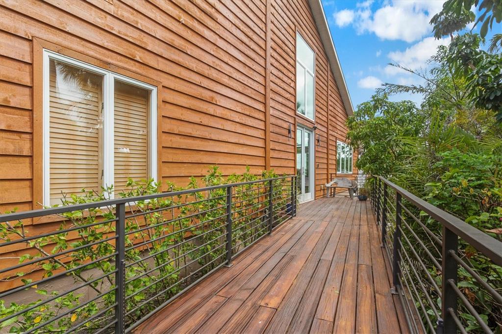 140 North Casey Key Road Osprey, FL 34229 - Photo 10 of 91 a view of balcony with lots of trees