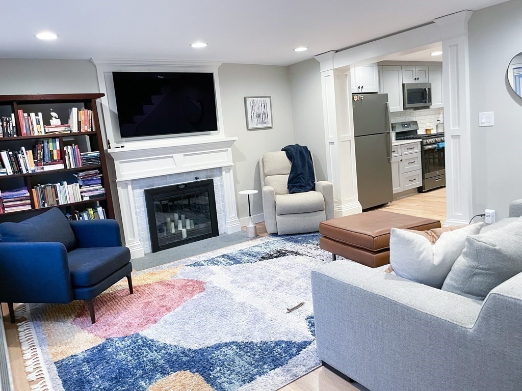 83 Rockridge Road Waltham, MA 02453 - Photo 6 of 16 a living room with furniture or fireplace and a flat screen tv
