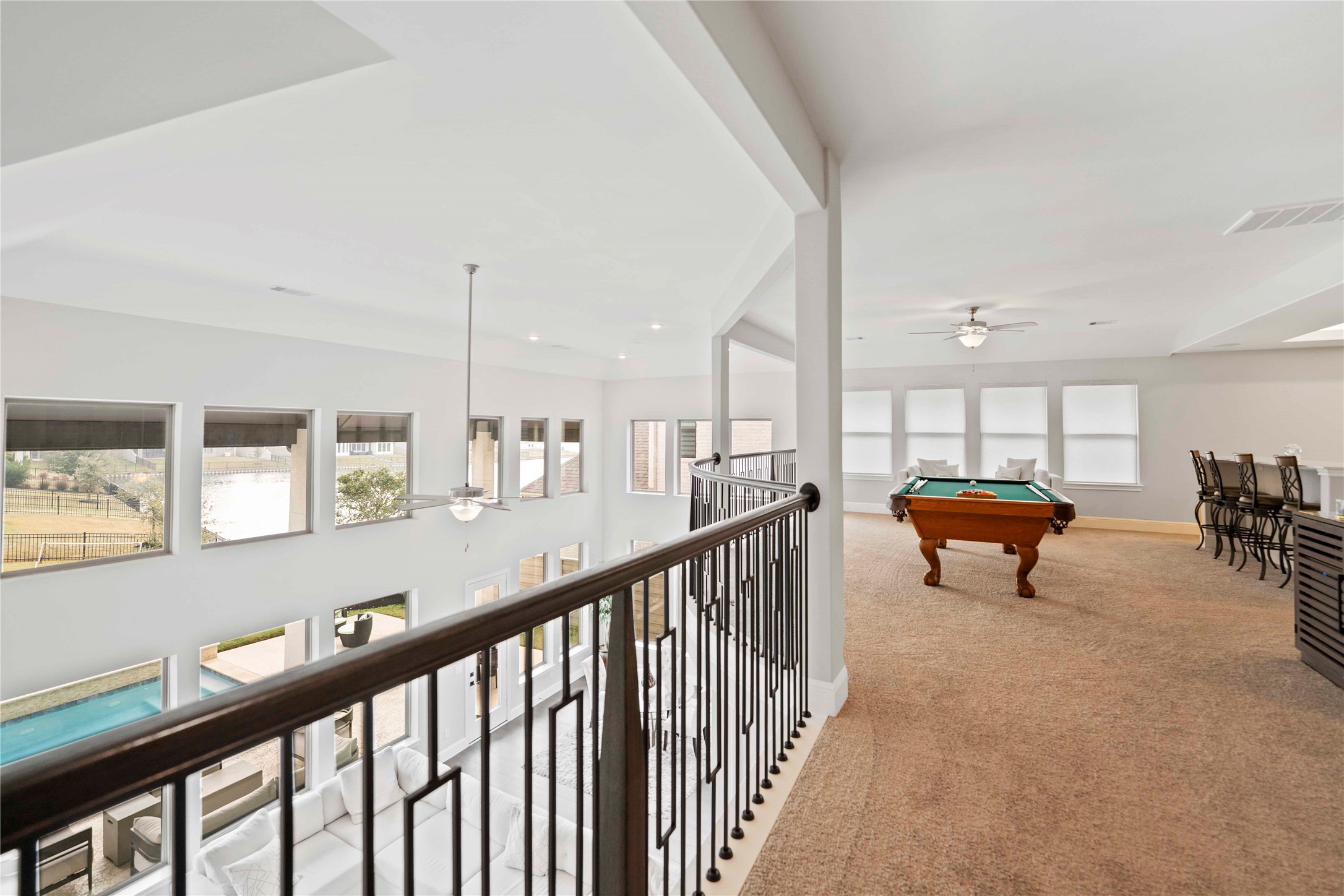 4315 Sandy Cv Drive Manvel, TX 77578 - Photo 27 of 50 A glimpse of the backyard and community lake from the upstairs gameroom