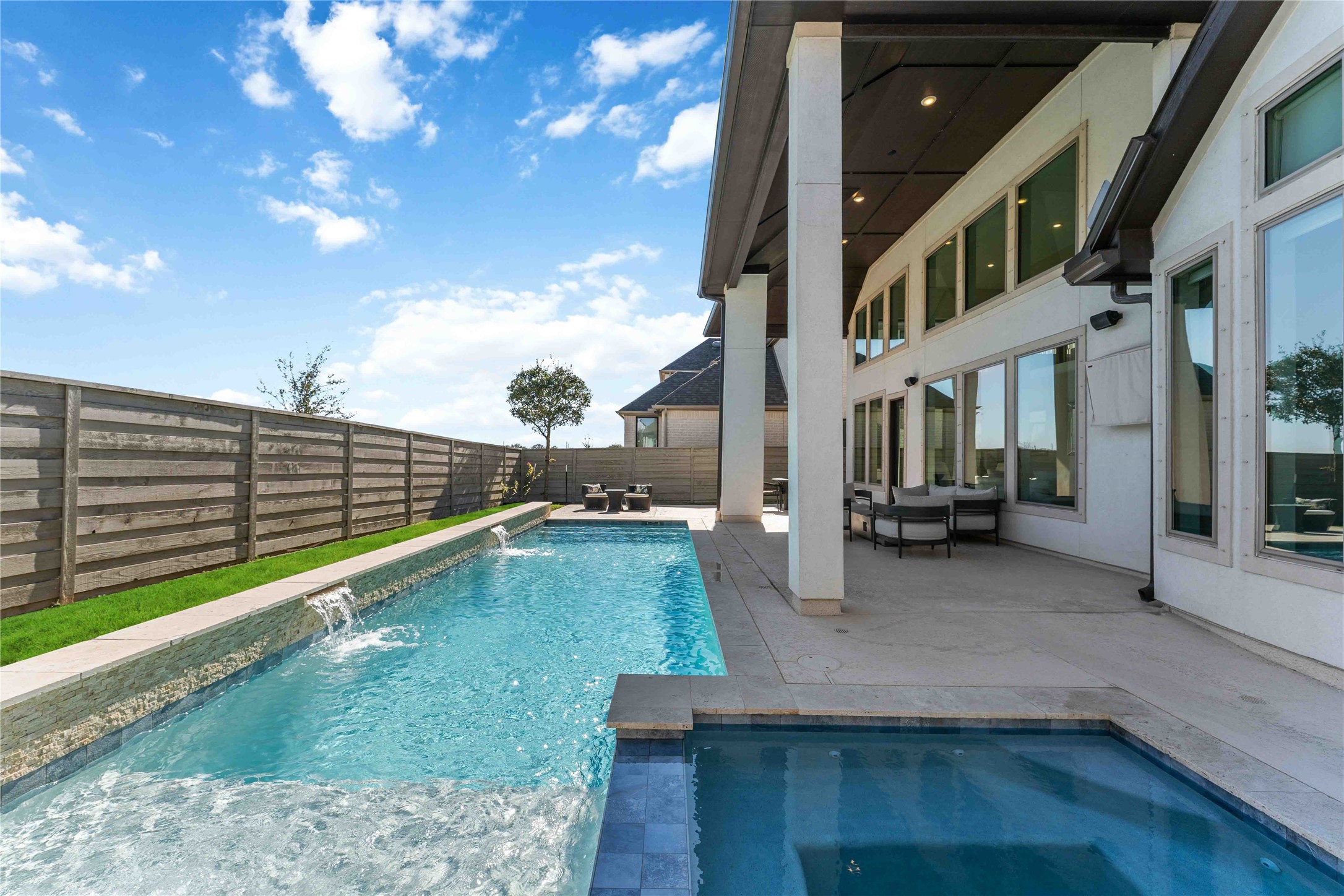 4315 Sandy Cv Drive Manvel, TX 77578 - Photo 42 of 50 Dive into luxury with a heated saltwater pool and jacuzzi, offering the ultimate relaxation retreat in your own backyard oasis.