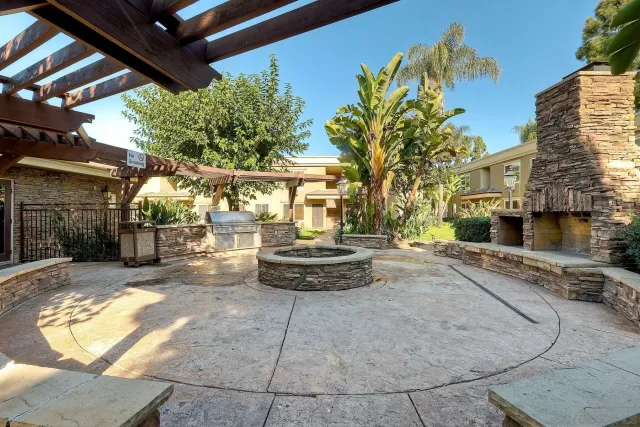 a view of a backyard with sitting area