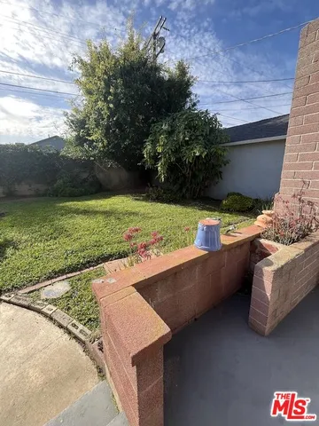 a view of a backyard of a house