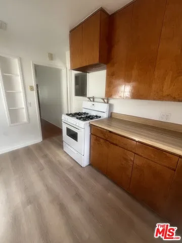 a kitchen with a stove and a sink