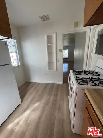 a kitchen that has a sink and a stove