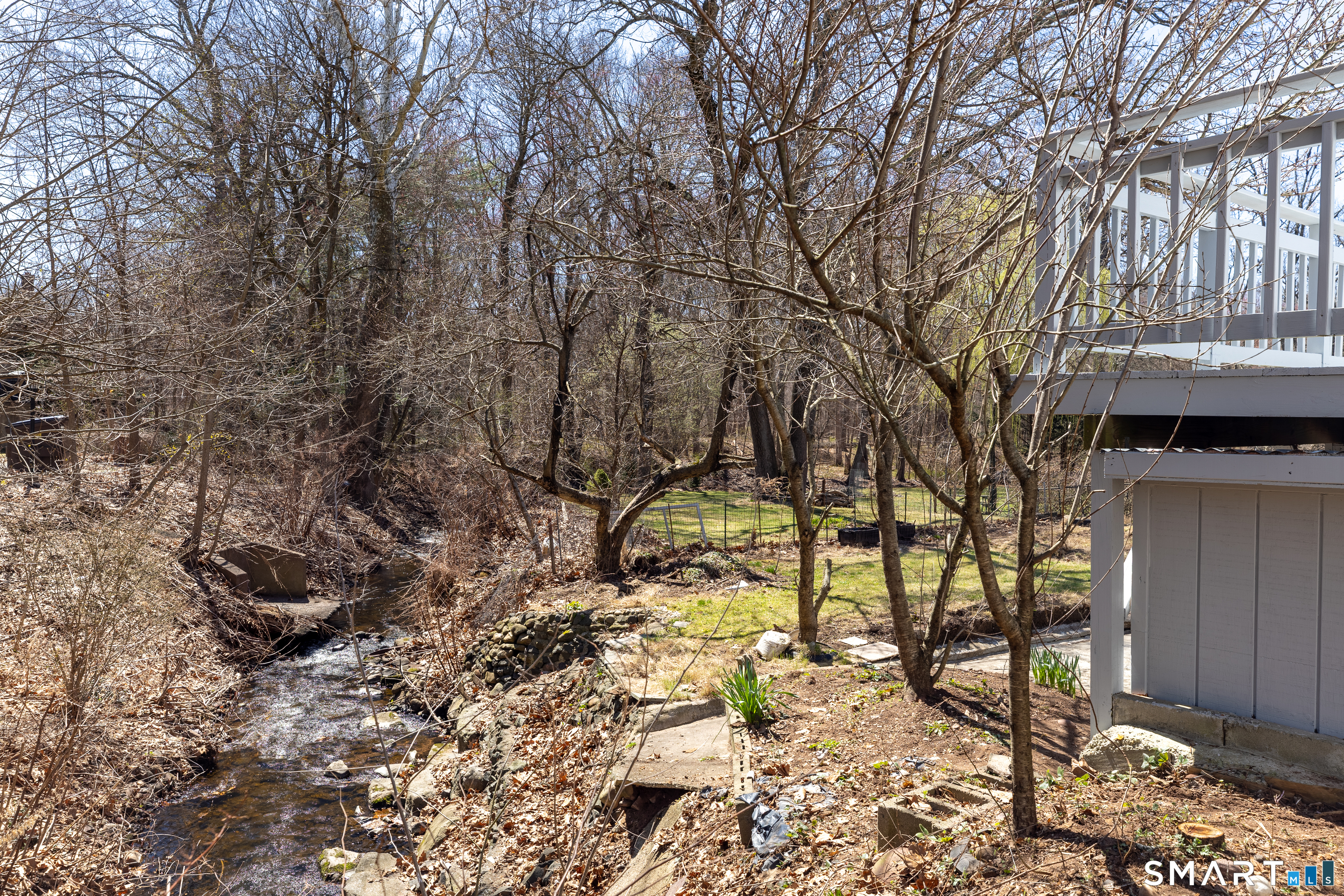 256 Charter Oak Street Manchester, CT 06040 - Photo 31 of 33 Backyard with Stream