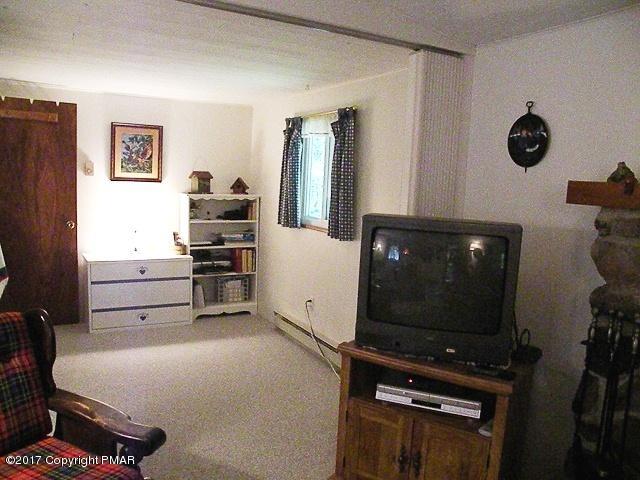 329 Ridge Road Pocono Lake, PA 18347 - Photo 14 of 17 a view of workspace with flat screen tv