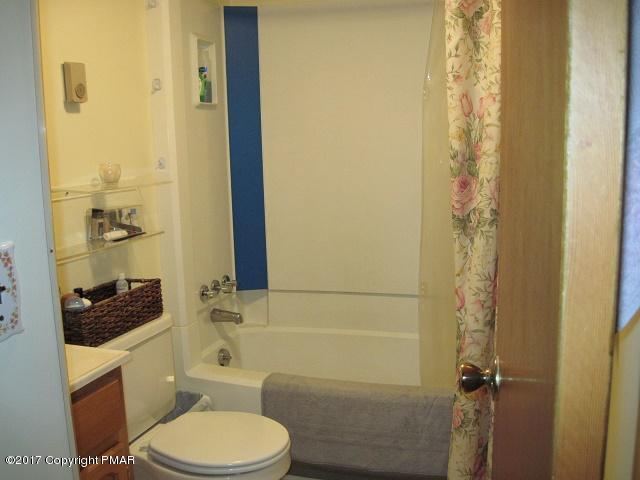 329 Ridge Road Pocono Lake, PA 18347 - Photo 16 of 17 a bathroom with a toilet a sink and shower