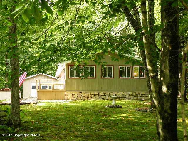 329 Ridge Road Pocono Lake, PA 18347 - Photo 2 of 17 a front view of a house with a yard
