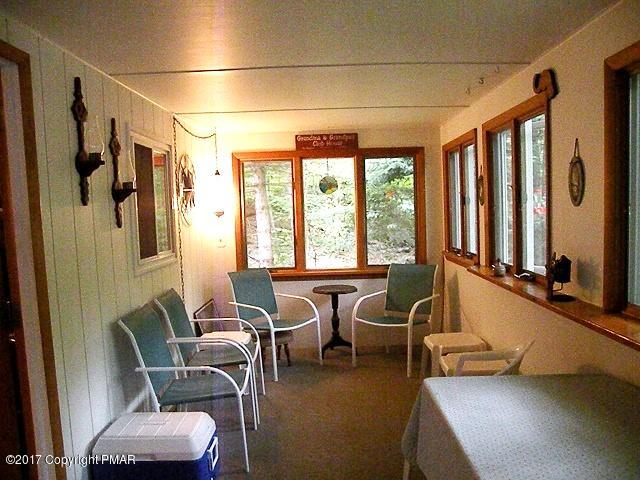 329 Ridge Road Pocono Lake, PA 18347 - Photo 6 of 17 a living room with furniture and a large window