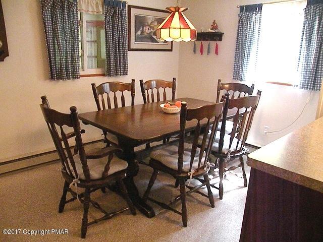 329 Ridge Road Pocono Lake, PA 18347 - Photo 8 of 17 a view of a dining room with furniture and a window