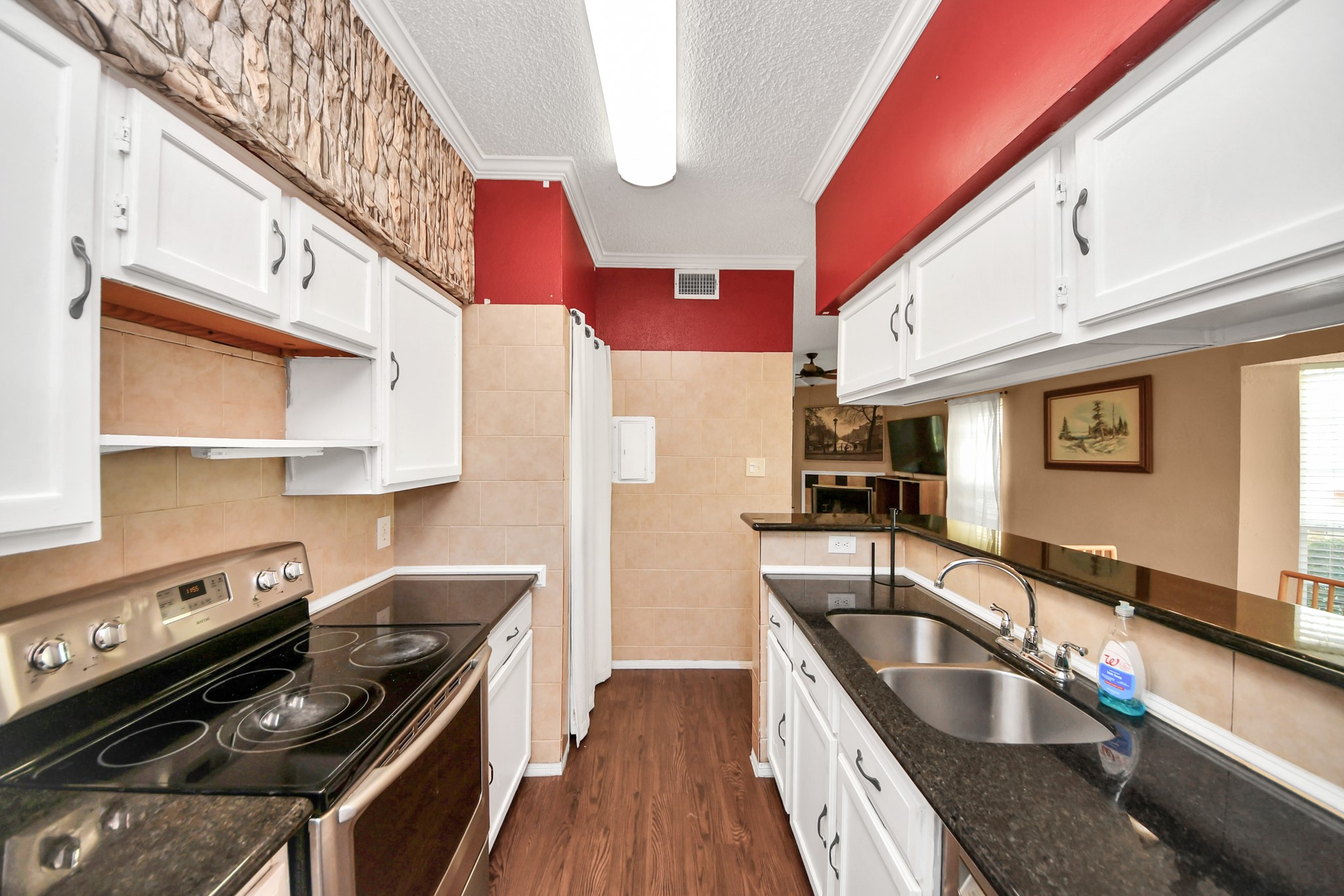 3600 Jeanetta Street, Unit 1804 Houston, TX 77063 - Photo 18 of 40 a kitchen with stainless steel appliances granite countertop a sink and a stove