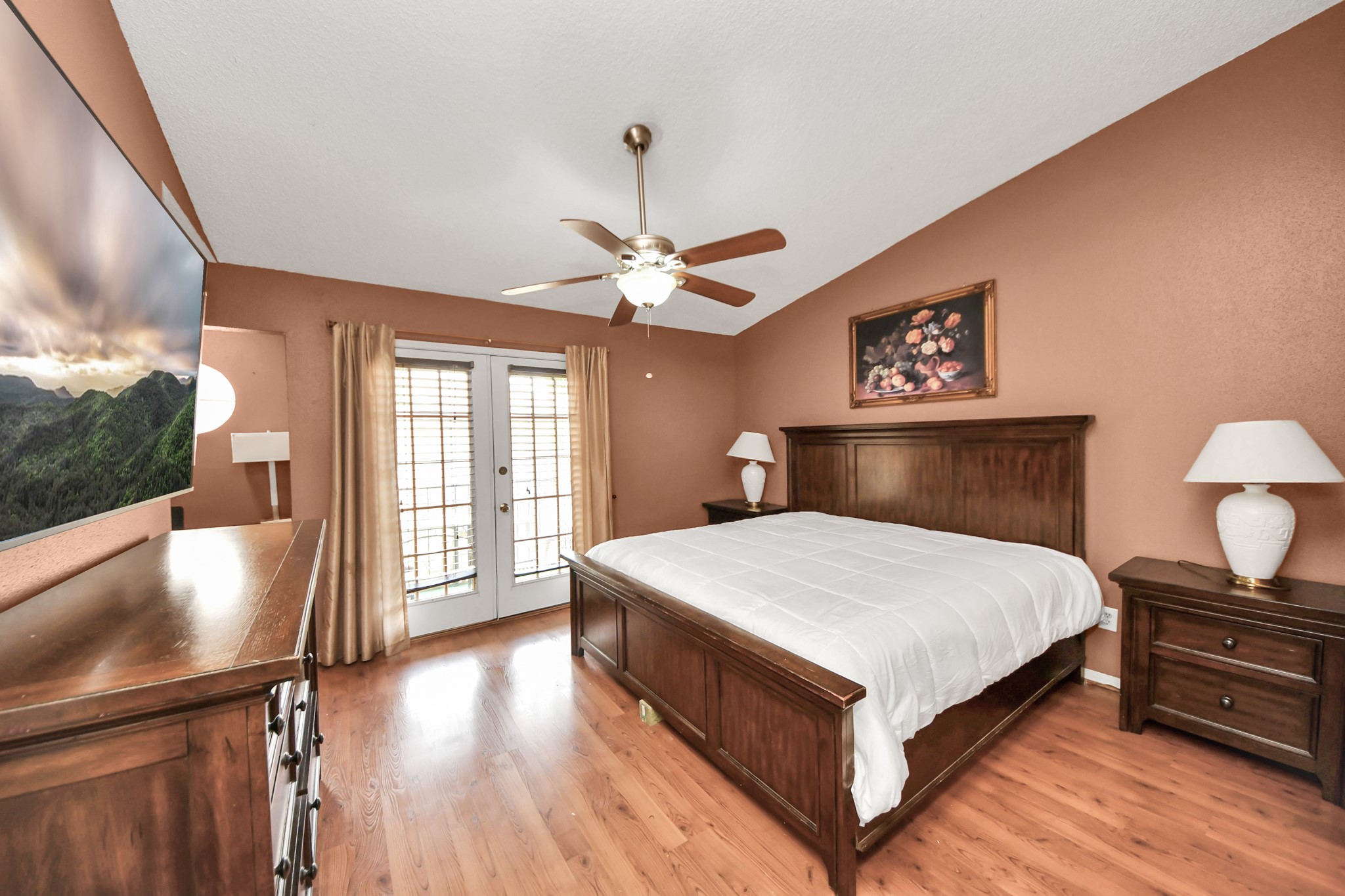 3600 Jeanetta Street, Unit 1804 Houston, TX 77063 - Photo 24 of 40 a bedroom with a bed and a flat screen tv