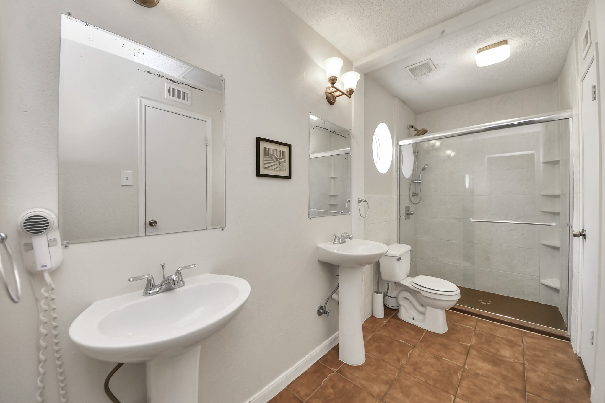 3600 Jeanetta Street, Unit 1804 Houston, TX 77063 - Photo 29 of 40 a bathroom with a sink a toilet a mirror and shower
