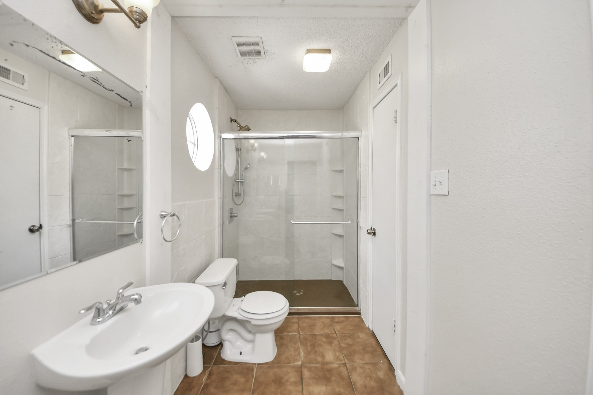 3600 Jeanetta Street, Unit 1804 Houston, TX 77063 - Photo 30 of 40 a bathroom with a sink a toilet and shower