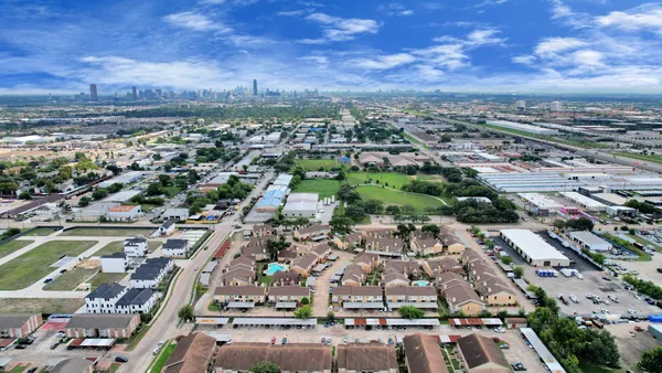 an aerial view of a city with lots of residential buildings