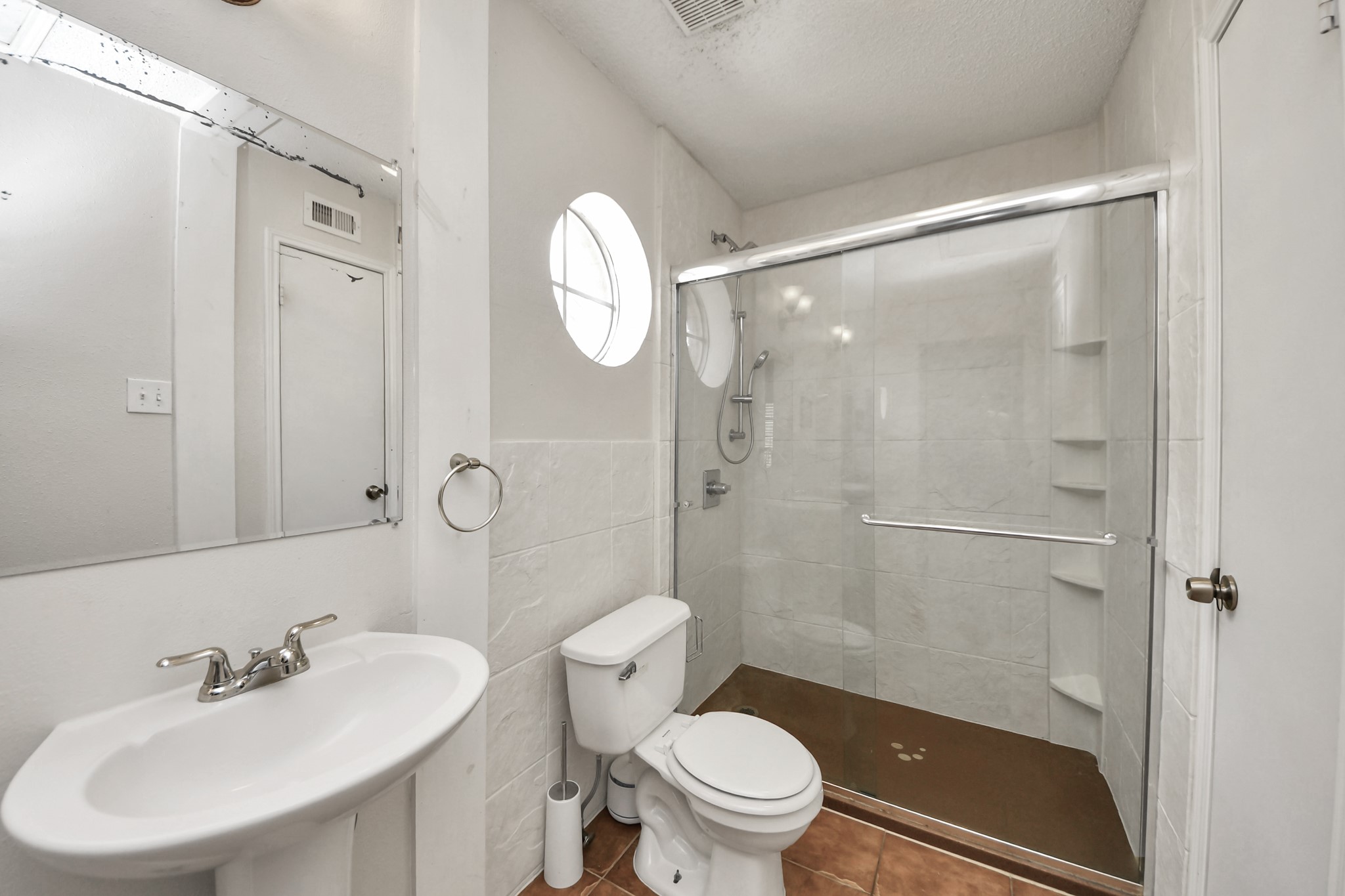 3600 Jeanetta Street, Unit 1804 Houston, TX 77063 - Photo 32 of 40 a bathroom with a sink a toilet and shower