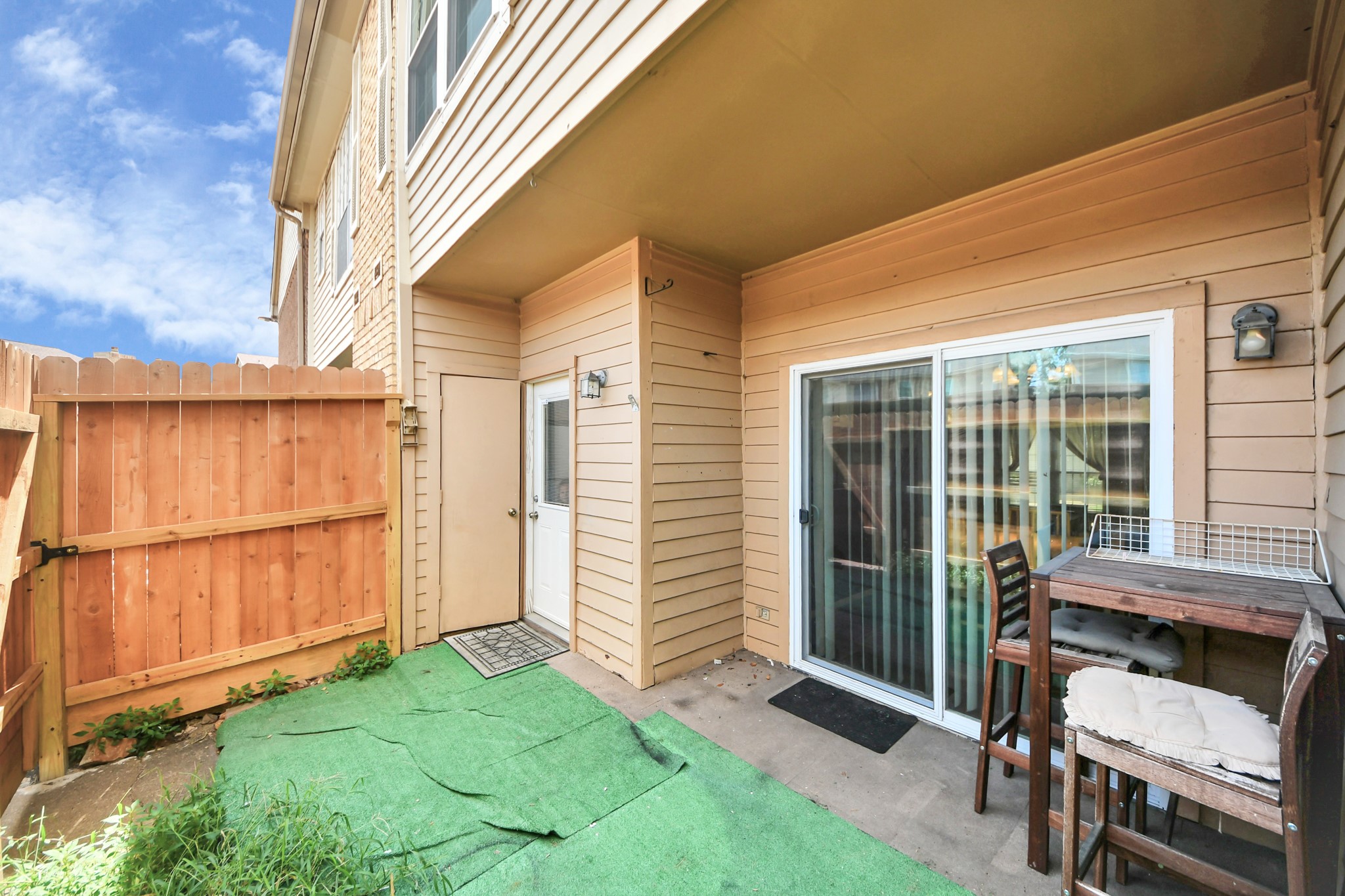 3600 Jeanetta Street, Unit 1804 Houston, TX 77063 - Photo 34 of 40 a view of a chair and table in backyard of the house