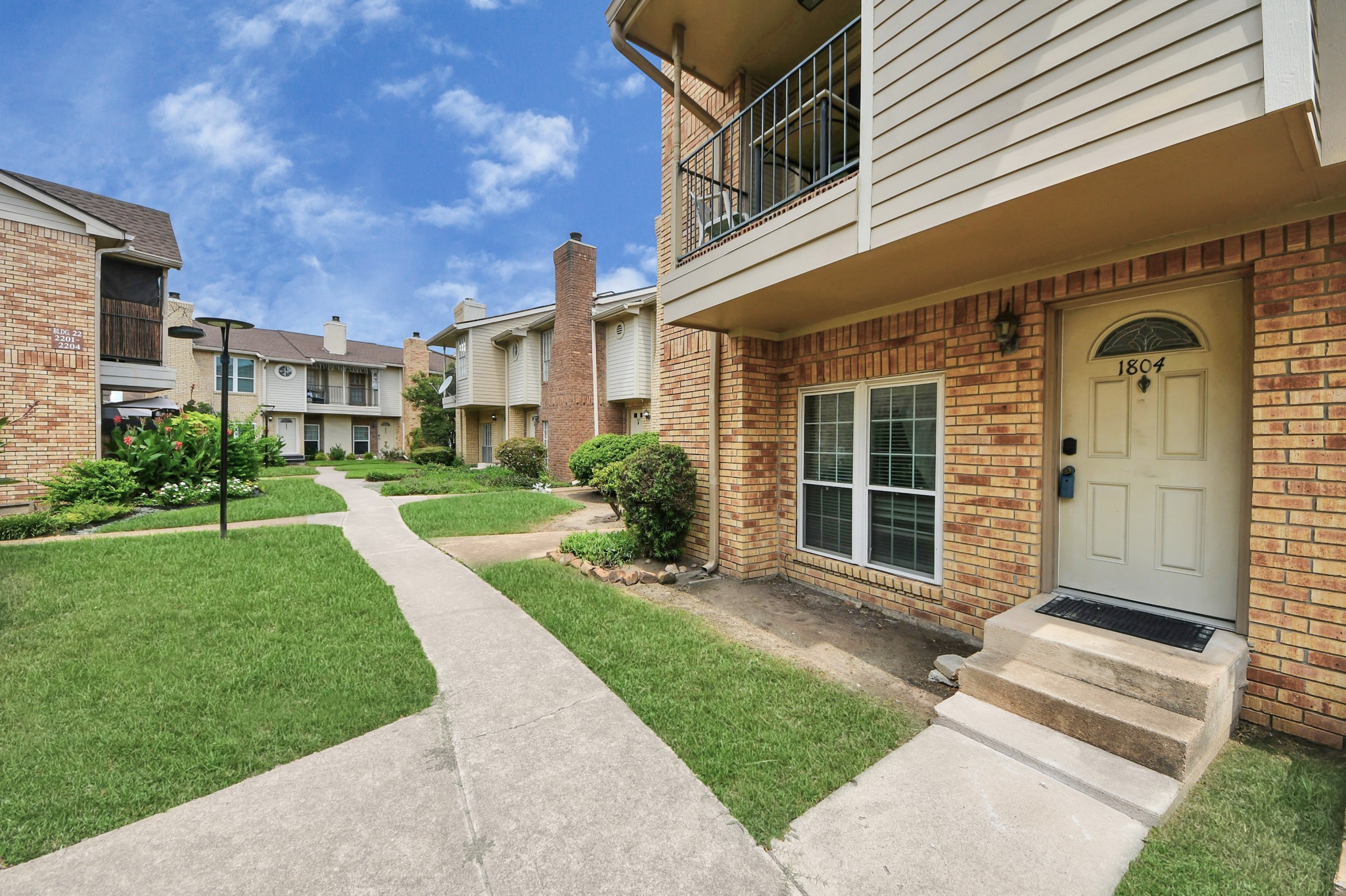3600 Jeanetta Street, Unit 1804 Houston, TX 77063 - Photo 35 of 40 a front view of a house with a yard