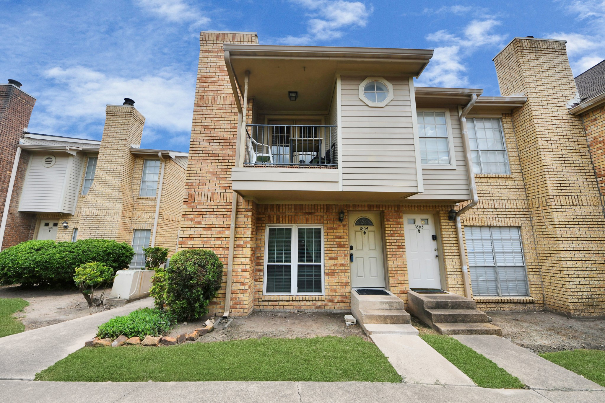 3600 Jeanetta Street, Unit 1804 Houston, TX 77063 - Photo 38 of 40 a front view of a house with a yard and potted plants