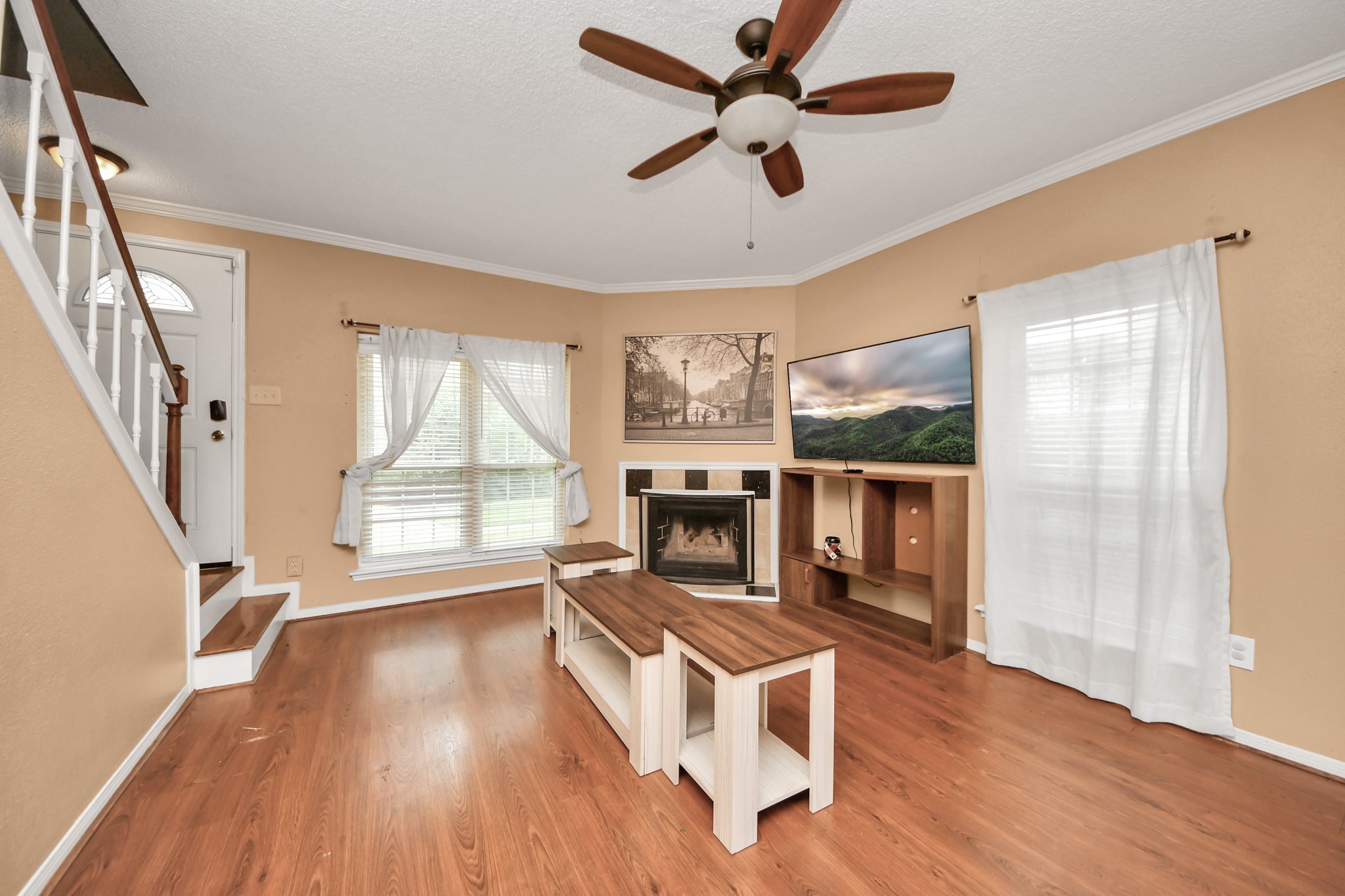 3600 Jeanetta Street, Unit 1804 Houston, TX 77063 - Photo 7 of 40 a living room with fireplace furniture and a large window