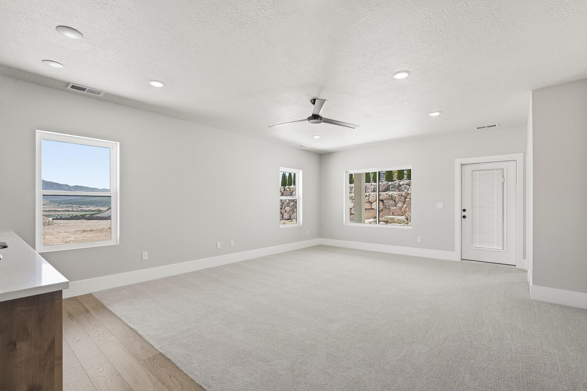 1852 South Hidden Canyon Road Cedar City, UT 84720 - Photo 45 of 79 Natural light and walkout access help this lower level live more like a second main floor.