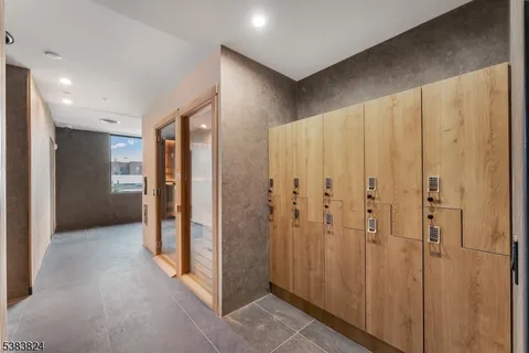 a view of a bathroom with a shower and a sink