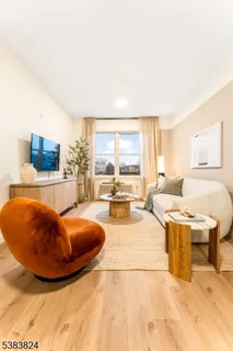 a living room with a table and sofas