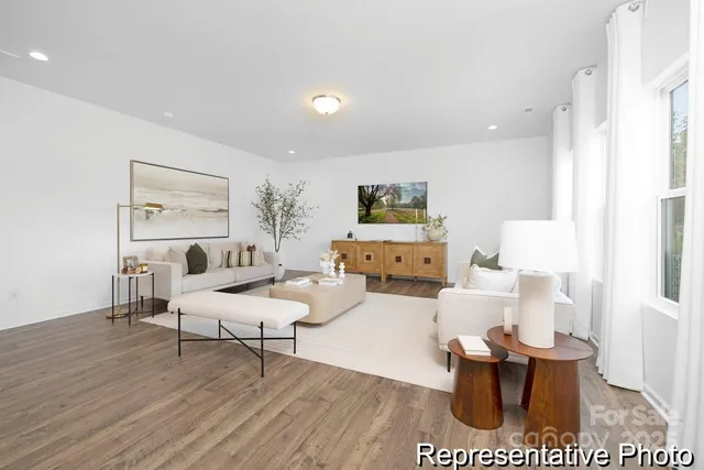 a living room with furniture and a table