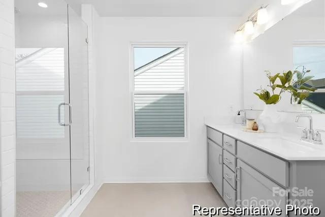 a bathroom with a sink a vanity and a mirror