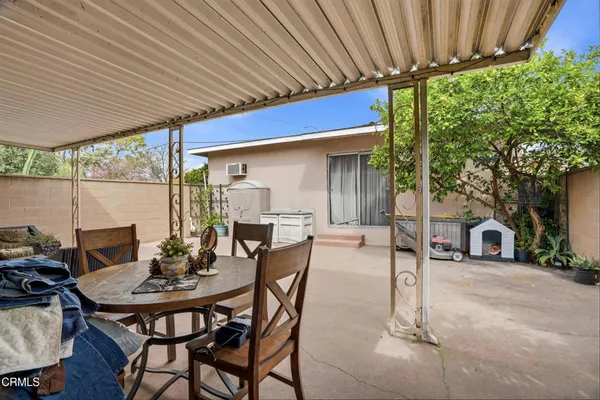a view of a chairs and tables in patio