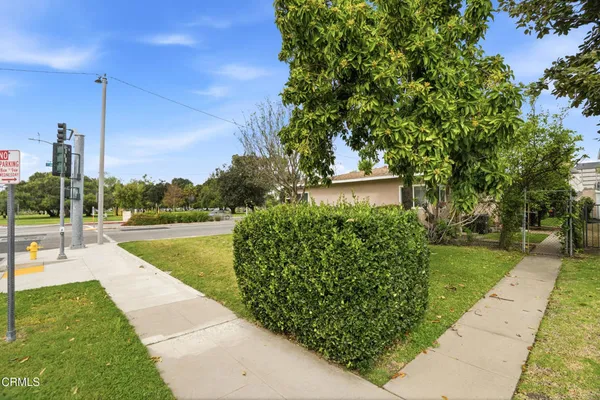 a view of a swimming pool with a yard