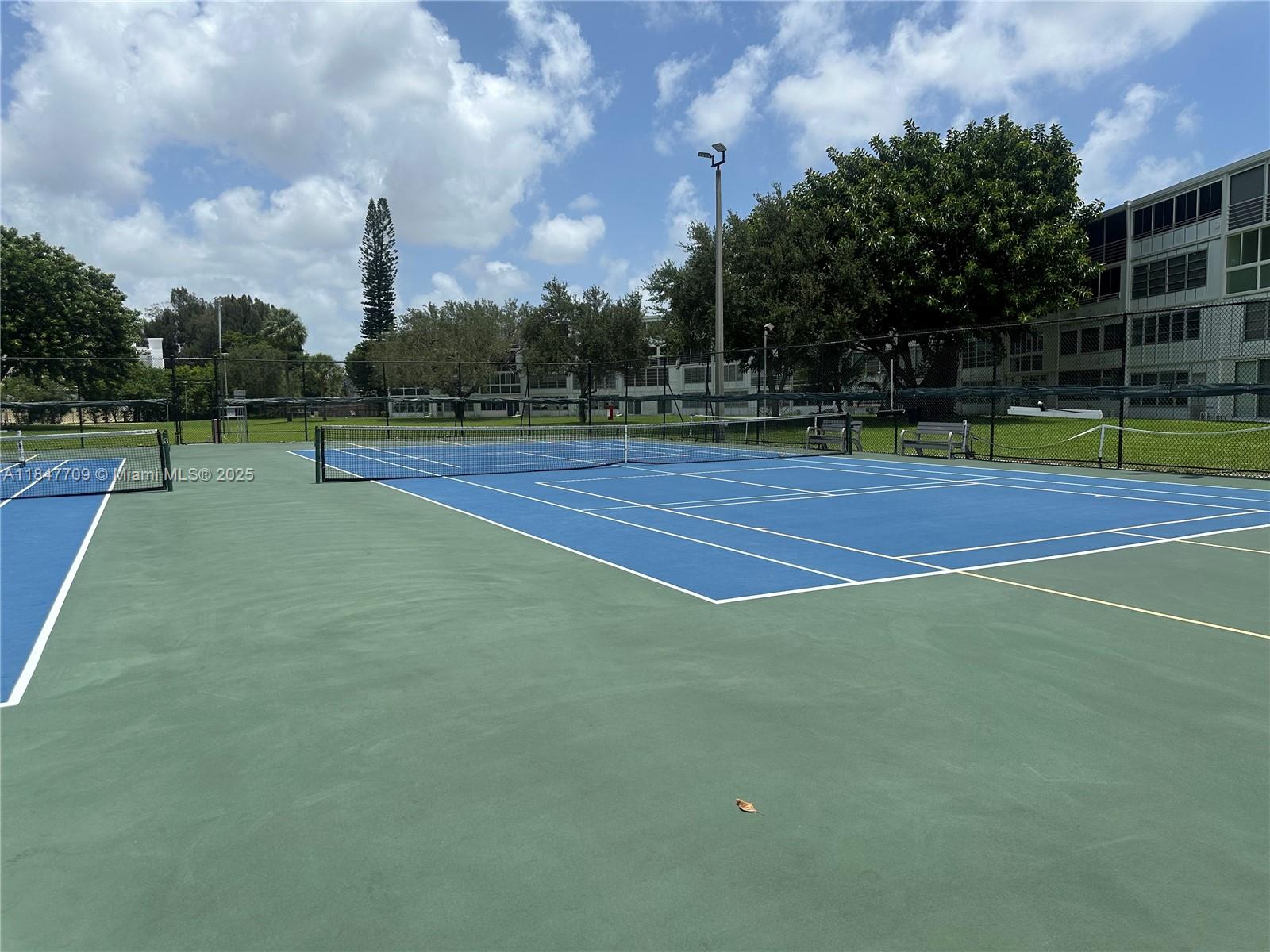 4027 Swansea Crescent, Unit 4027 Deerfield Beach, FL 33442 - Photo 40 of 47 a view of a tennis court