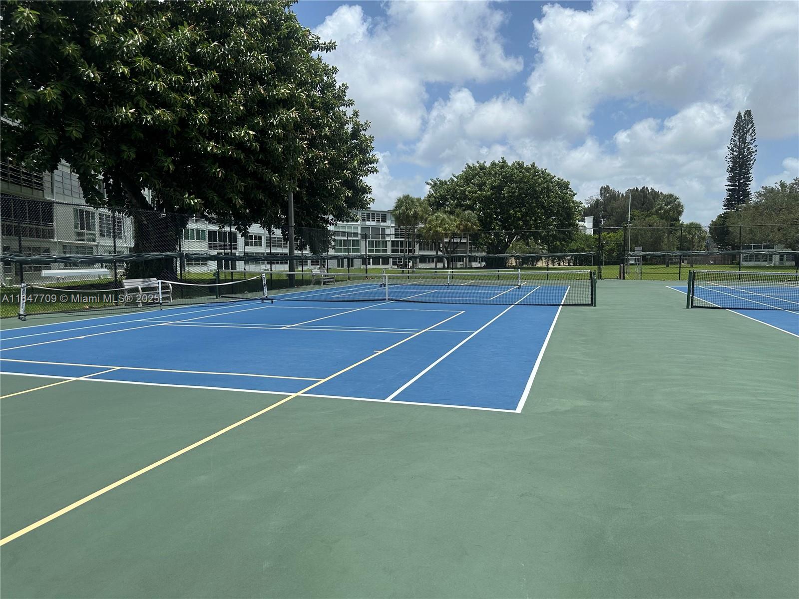 4027 Swansea Crescent, Unit 4027 Deerfield Beach, FL 33442 - Photo 41 of 47 a view of a tennis court