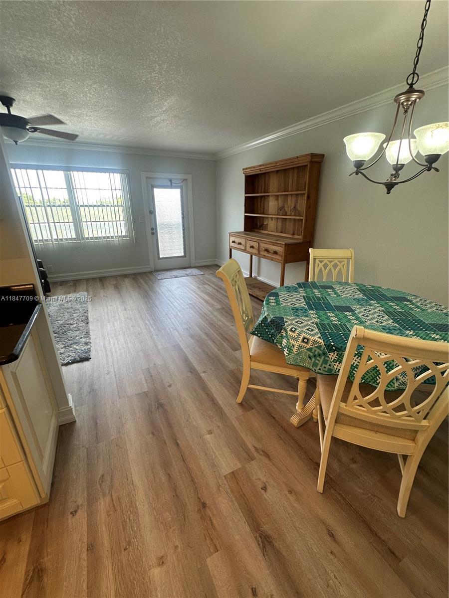 4027 Swansea Crescent, Unit 4027 Deerfield Beach, FL 33442 - Photo 8 of 47 a living room with furniture and a window