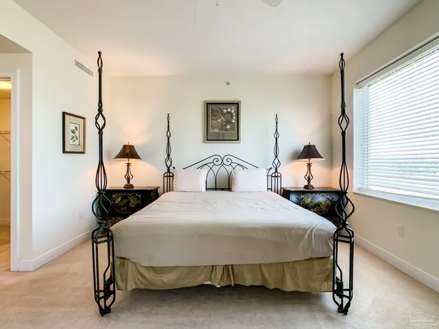 a bedroom with a bed and window