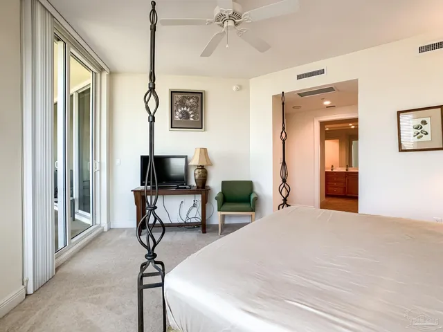 a bedroom with a bed and a chair