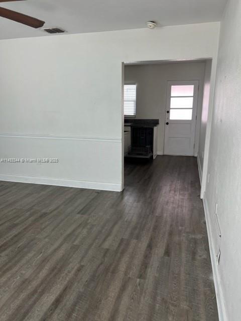 3524 Eagle Drive Orlando, FL 32804 - Photo 4 of 7 an empty room with wooden floor and windows